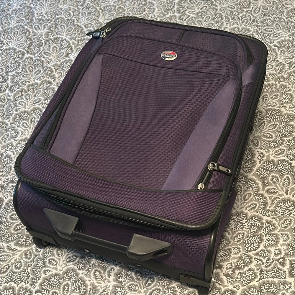 American Tourister Purple Carry-On Rolling Suitcase